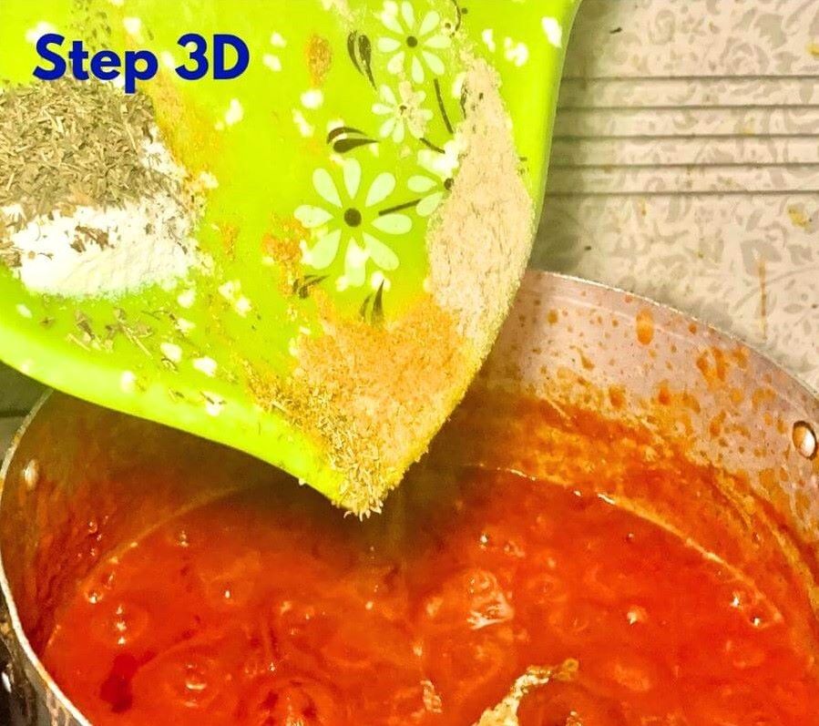Adding-Spices-to-Nigerian-Oiless-Beef-Stew-