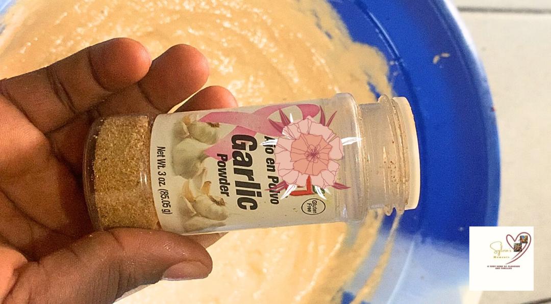 Adding-Garlic-to-Moi-Moi-mixture.