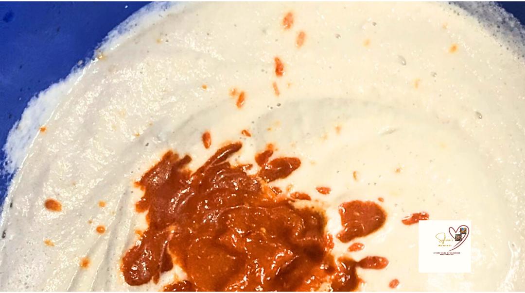 Moi Moi Recipe | How To Make Beans Pudding In Nigeria ; Pouring-blended-tatashe-and-onins-to-Moi-Moi-Mixture