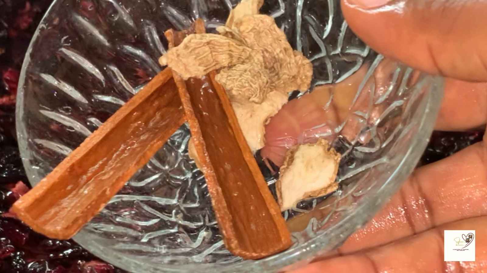 Adding-washed-dried-ginger-and-cinnamon-to-Zobo-drink